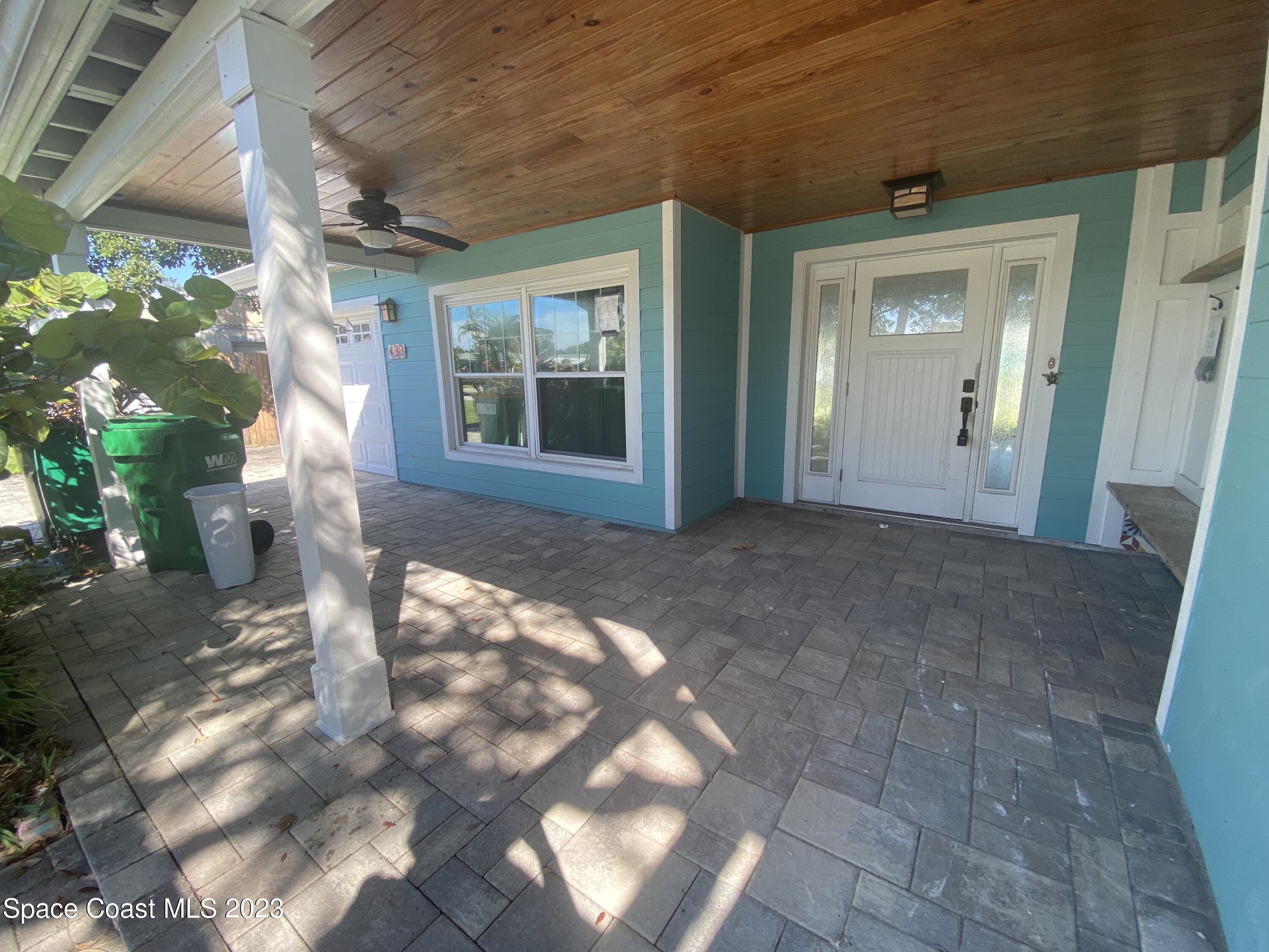 433 Blakey Boulevard Cocoa Beach, FL 32931 - Photo 3 of 15 a view of a porch with a yard