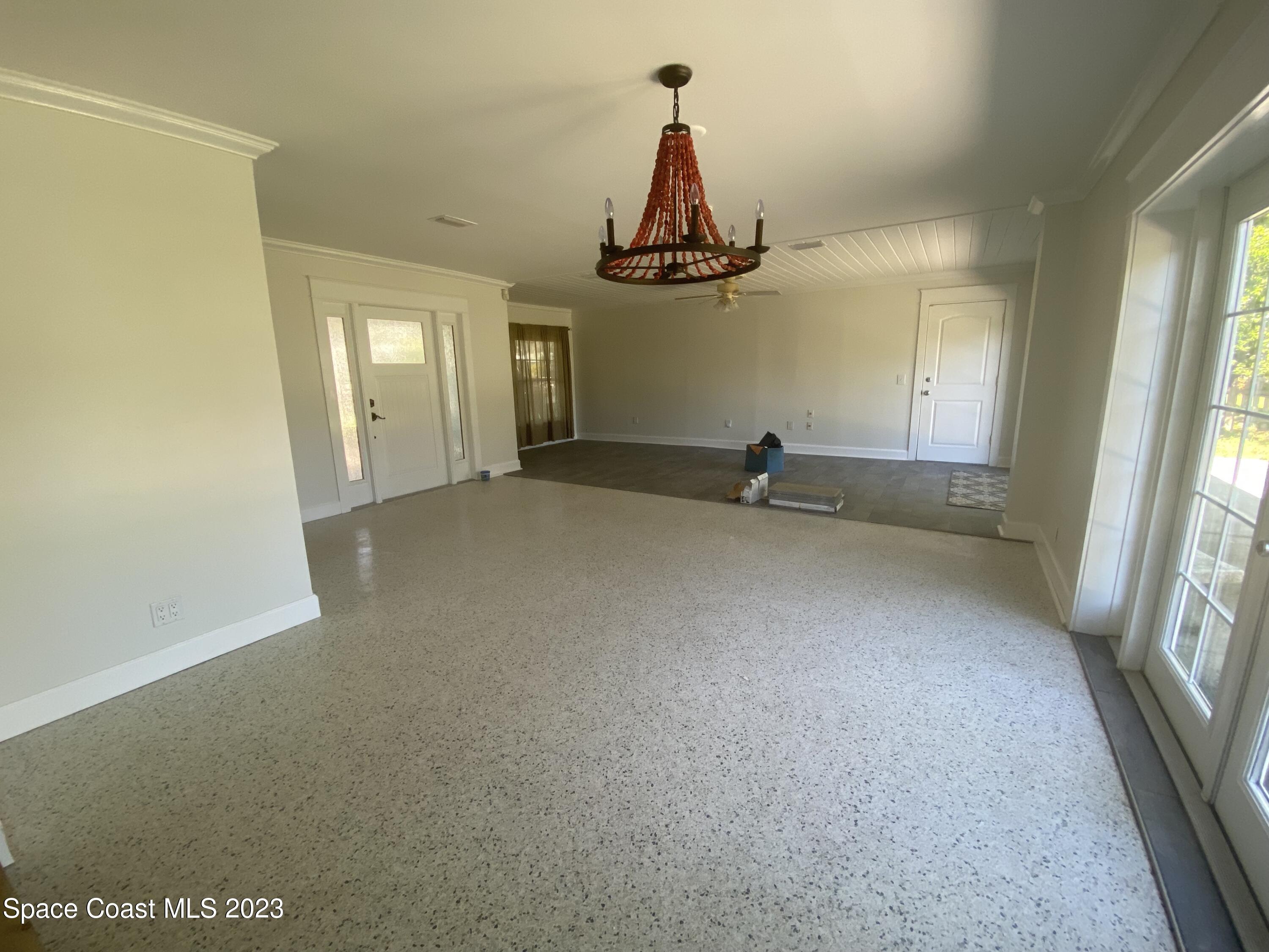 433 Blakey Boulevard Cocoa Beach, FL 32931 - Photo 6 of 15 an empty room with windows