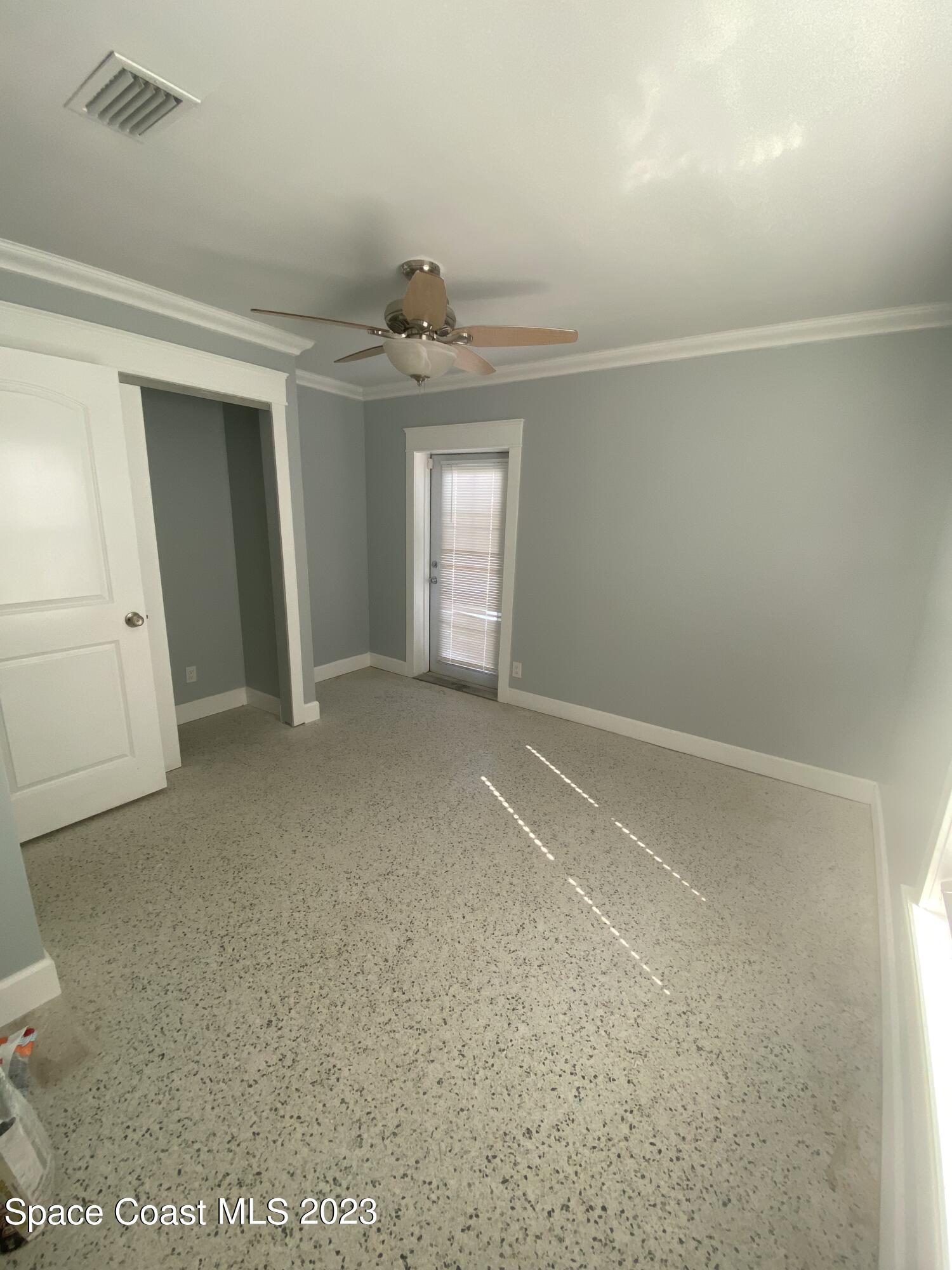 433 Blakey Boulevard Cocoa Beach, FL 32931 - Photo 7 of 15 en empty room with windows and closet