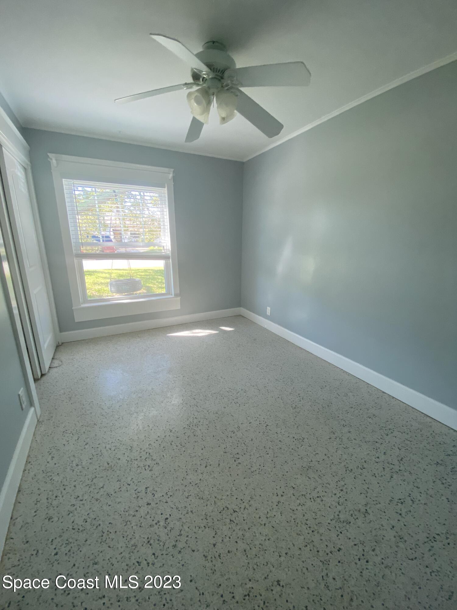 433 Blakey Boulevard Cocoa Beach, FL 32931 - Photo 10 of 15 an empty room with a window
