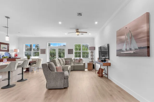 an empty room with a ceiling fan and a window