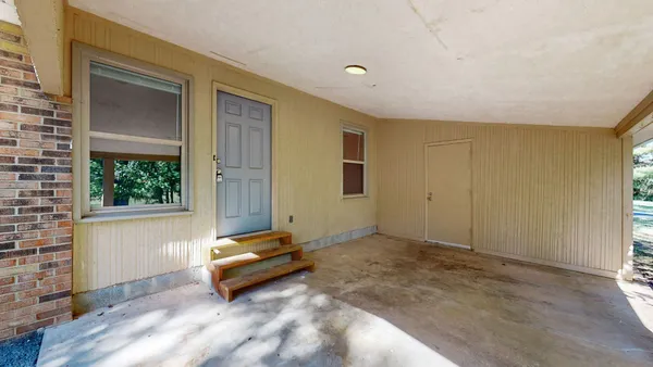 an empty room with windows