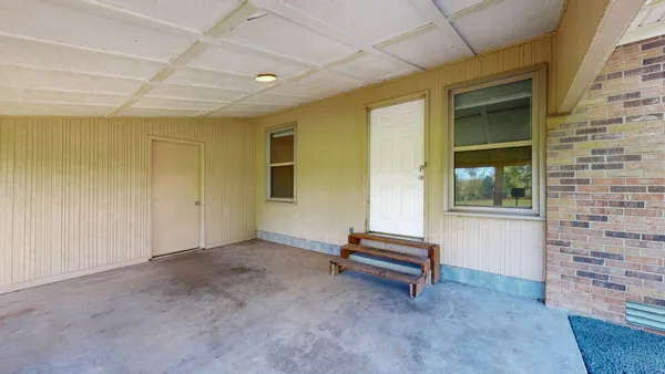 a view of room with a ceiling fan