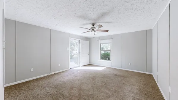 a view of an empty room with a window