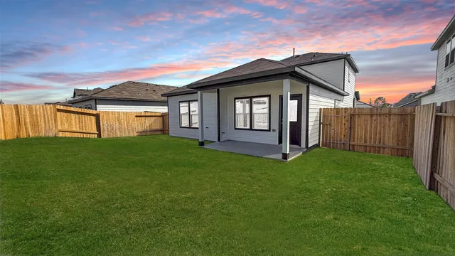a front view of a house with yard