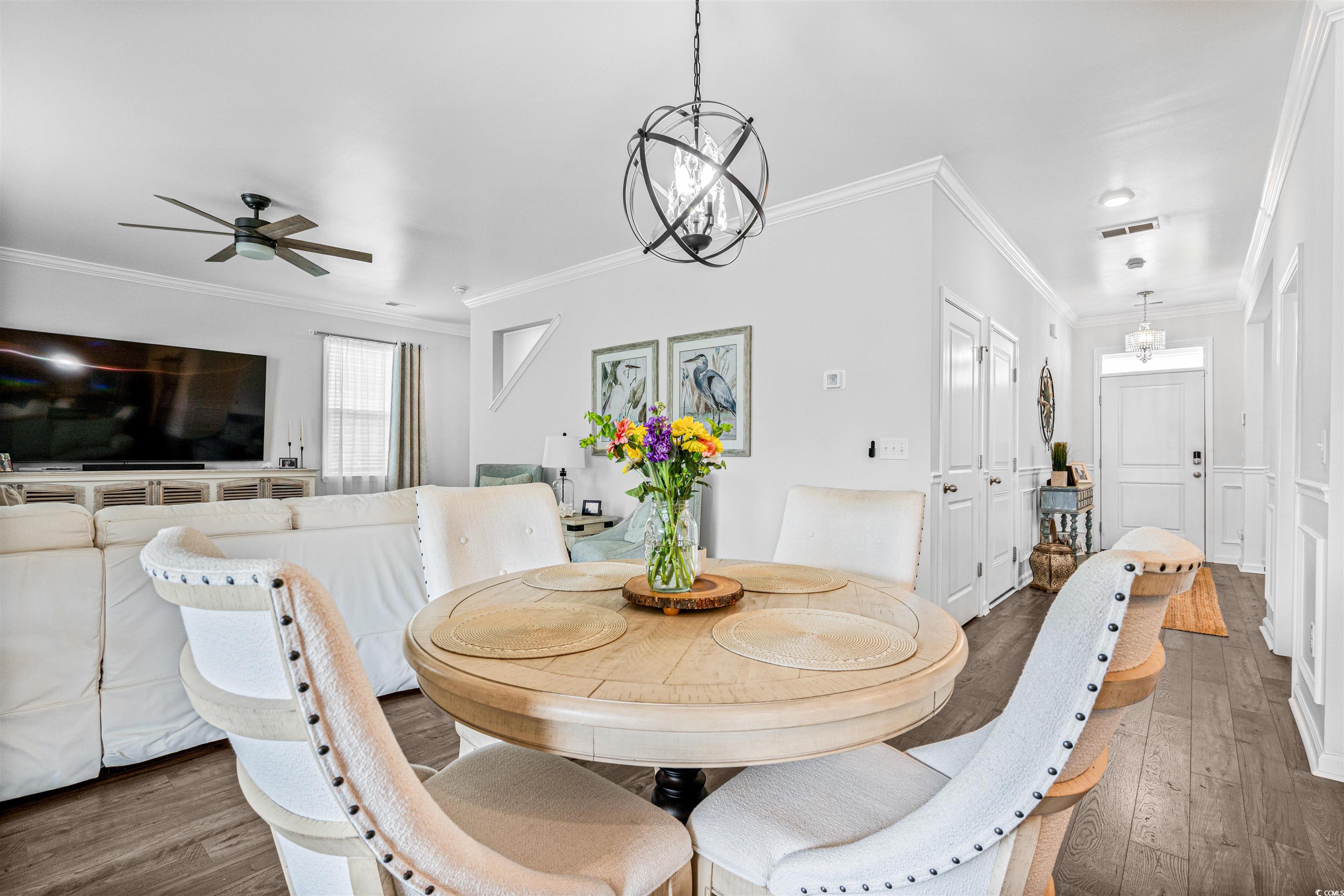 331 Emery Oak Drive Murrells Inlet, SC 29576 - Photo 13 of 32 Dining area with accented with a modern chandelier.