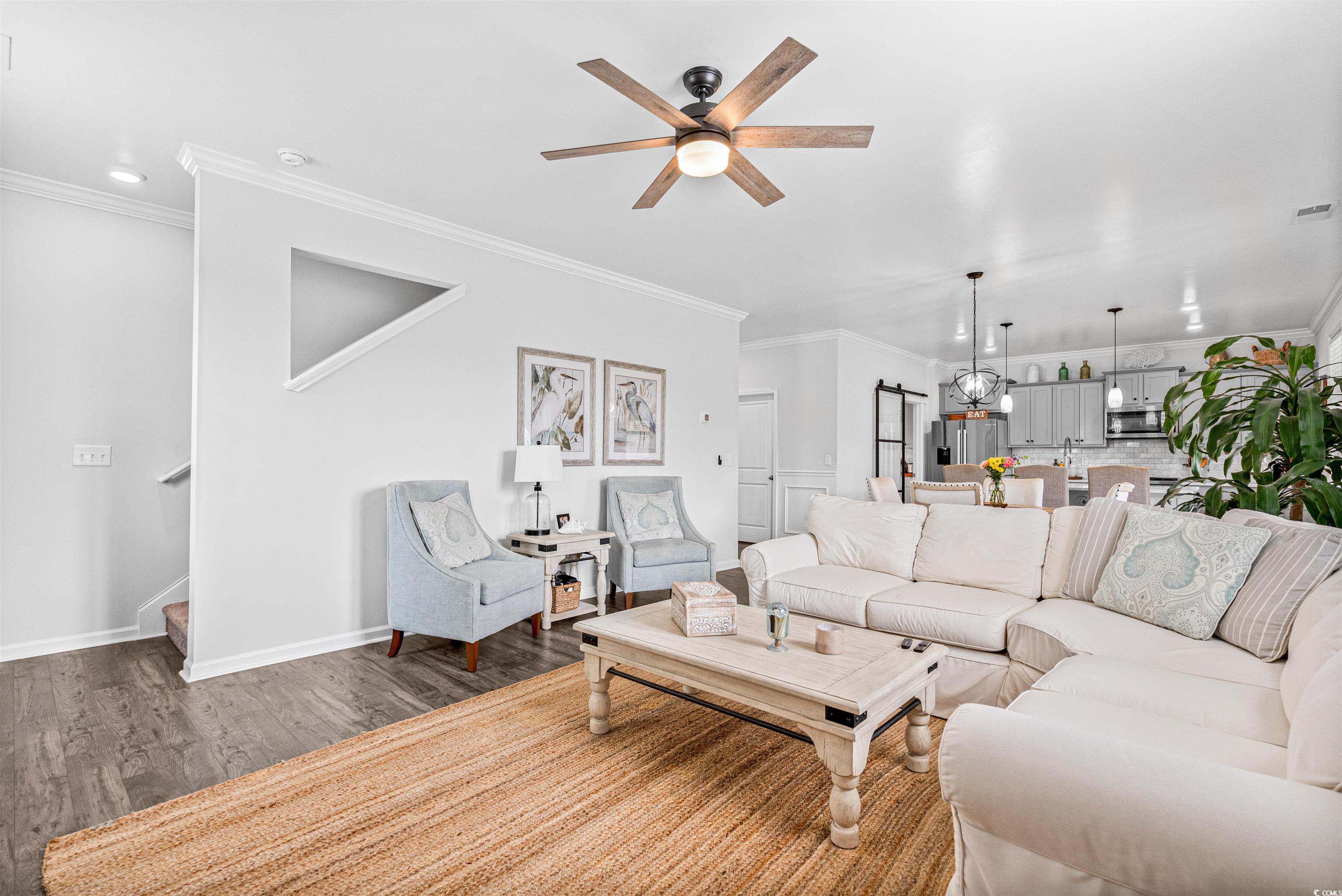 331 Emery Oak Drive Murrells Inlet, SC 29576 - Photo 14 of 32 Living area featuring luxury plank vinyl flooring and ceiling fan.
