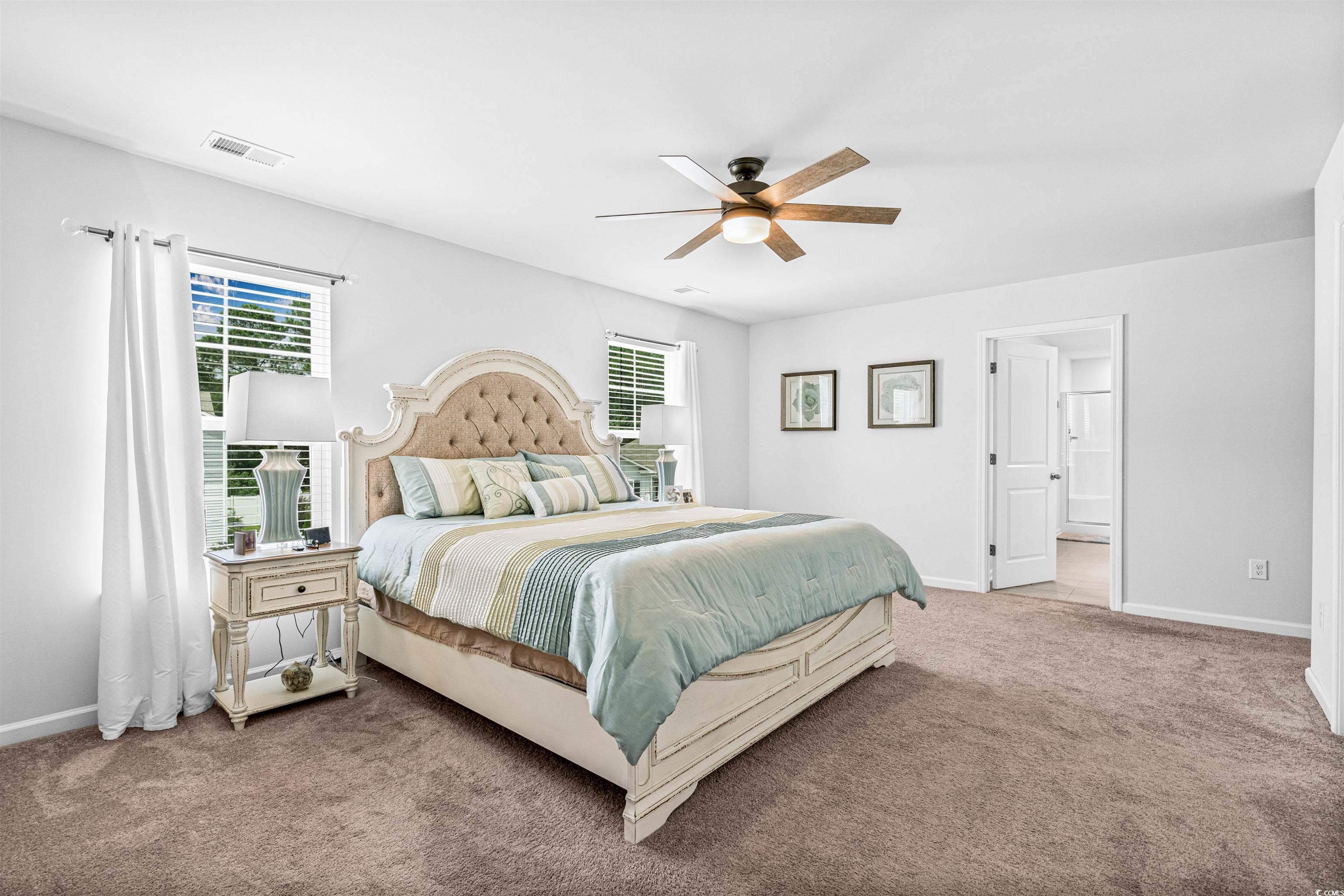 331 Emery Oak Drive Murrells Inlet, SC 29576 - Photo 19 of 32 Owner's suite with lots of natural light.