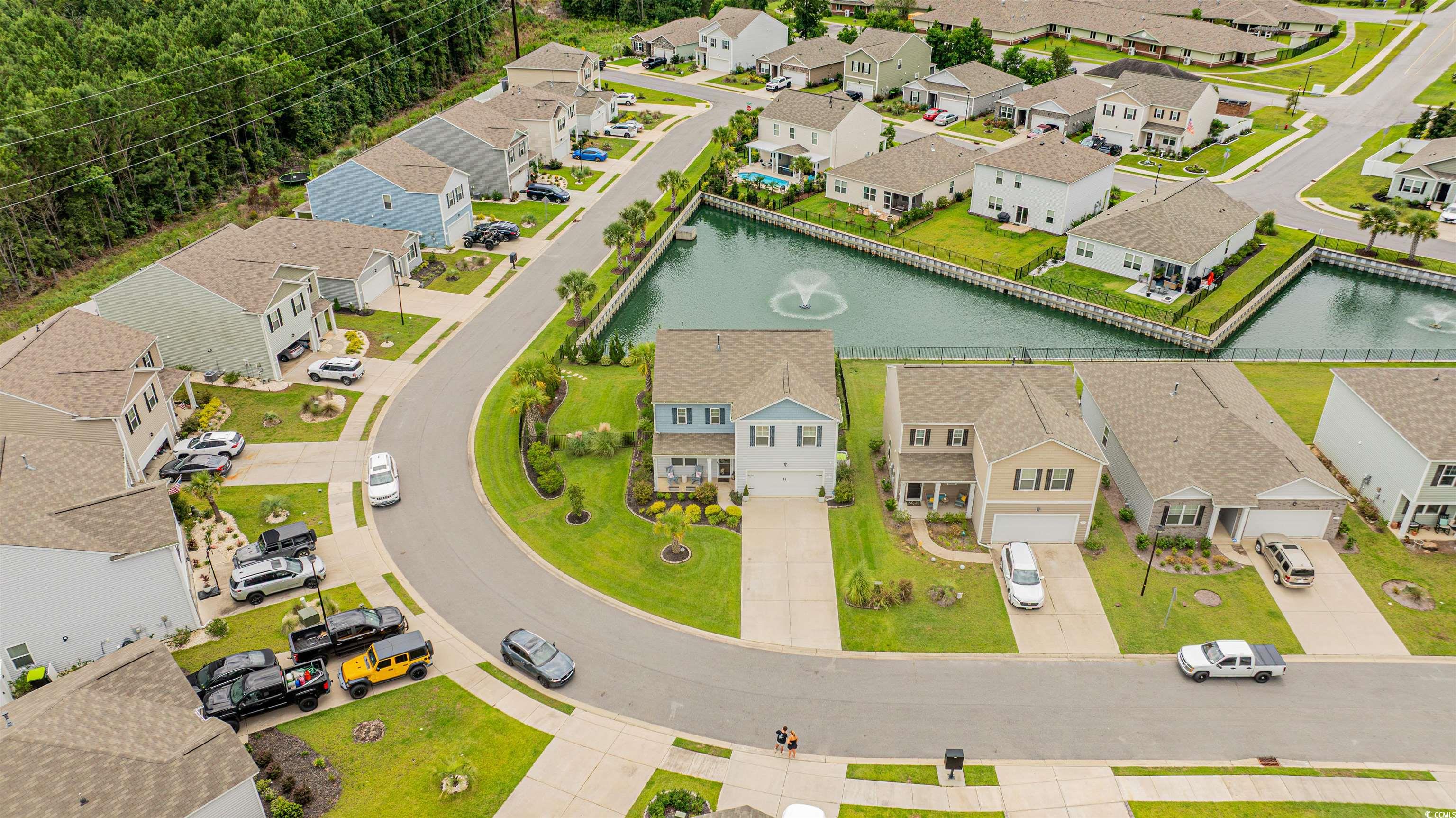 331 Emery Oak Drive Murrells Inlet, SC 29576 - Photo 2 of 32 Serene view of the pond and fountain.