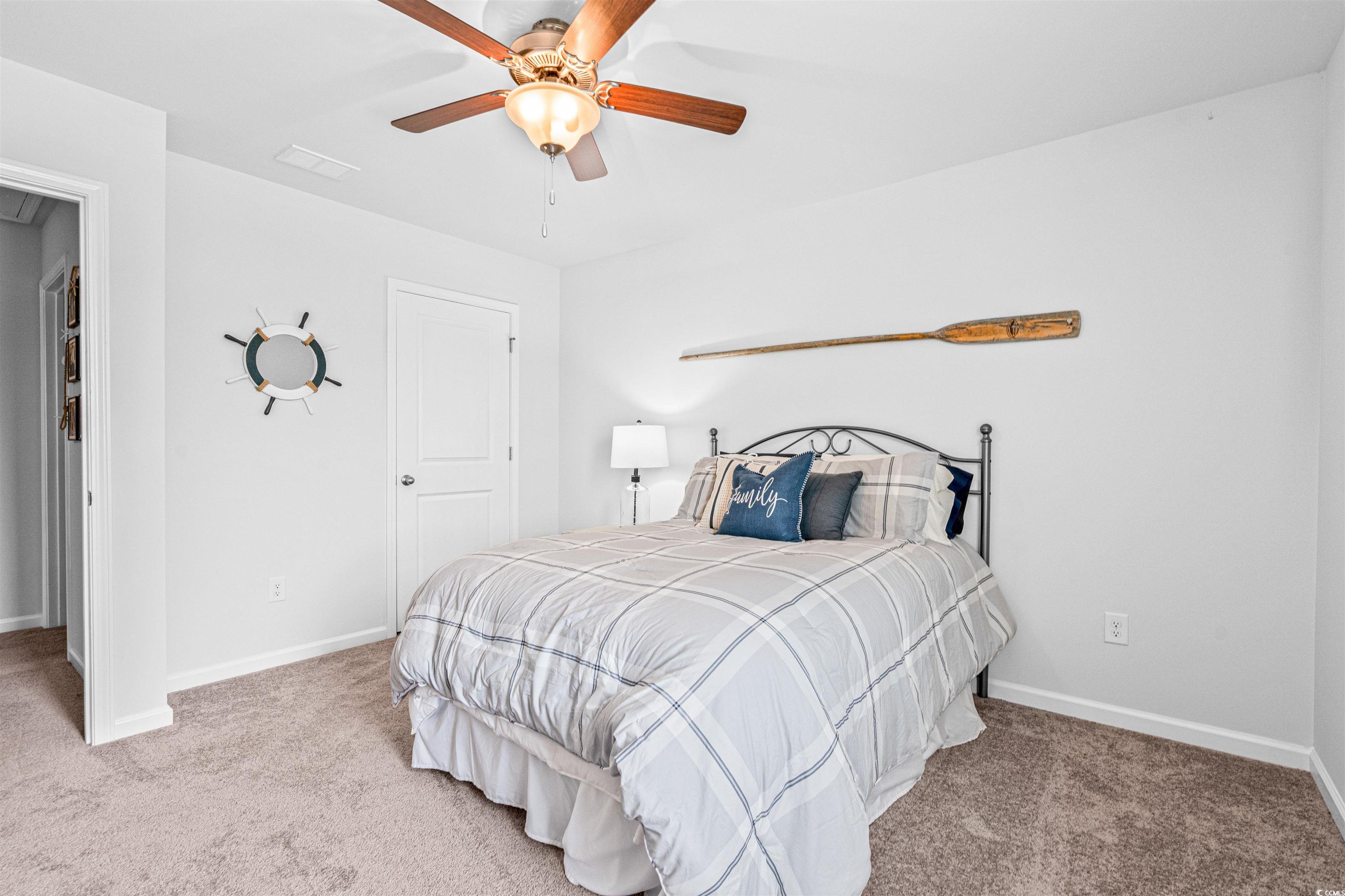 331 Emery Oak Drive Murrells Inlet, SC 29576 - Photo 22 of 32 Guest bedroom with ceiling fan.