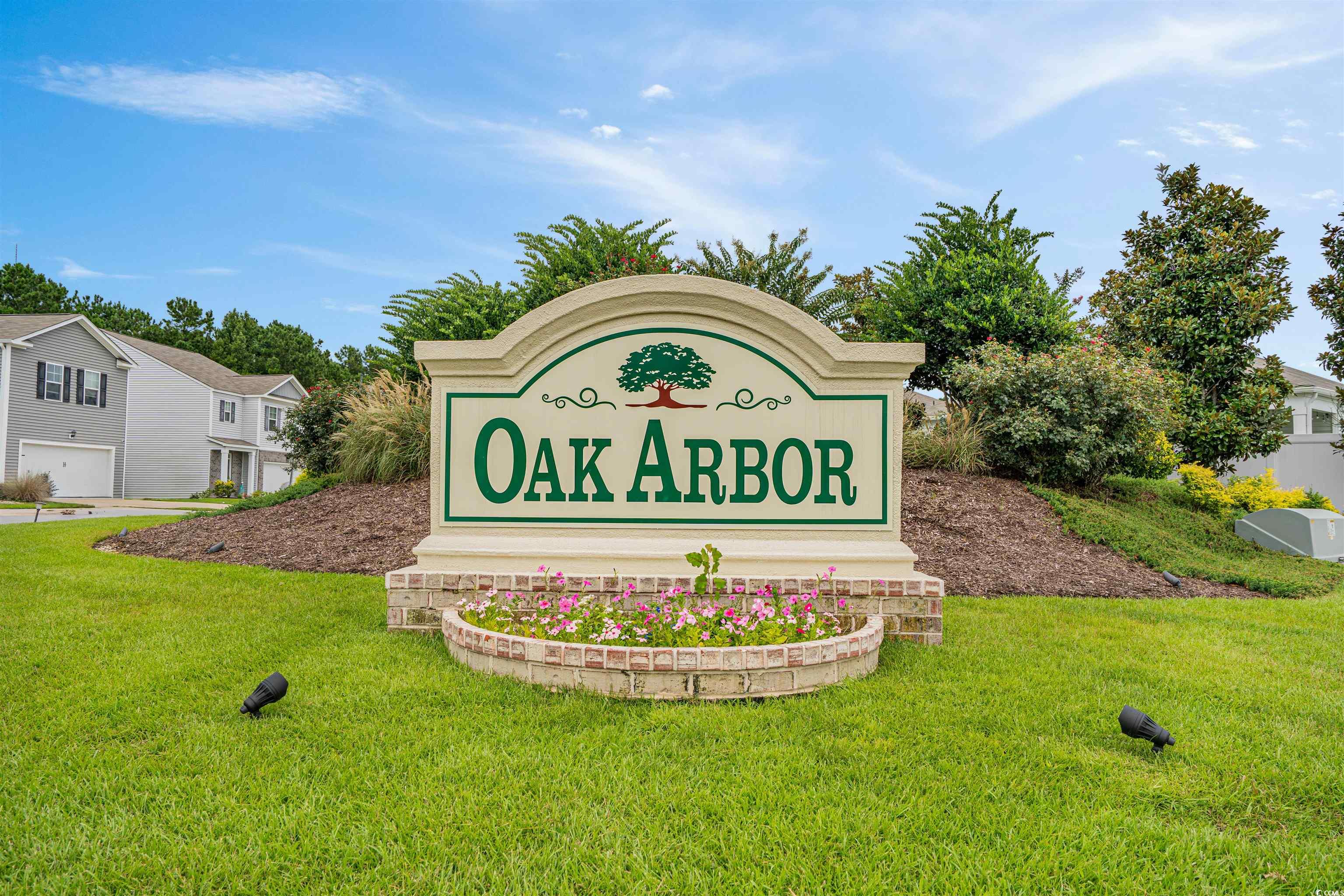 331 Emery Oak Drive Murrells Inlet, SC 29576 - Photo 32 of 32 Community sign featuring a lawn