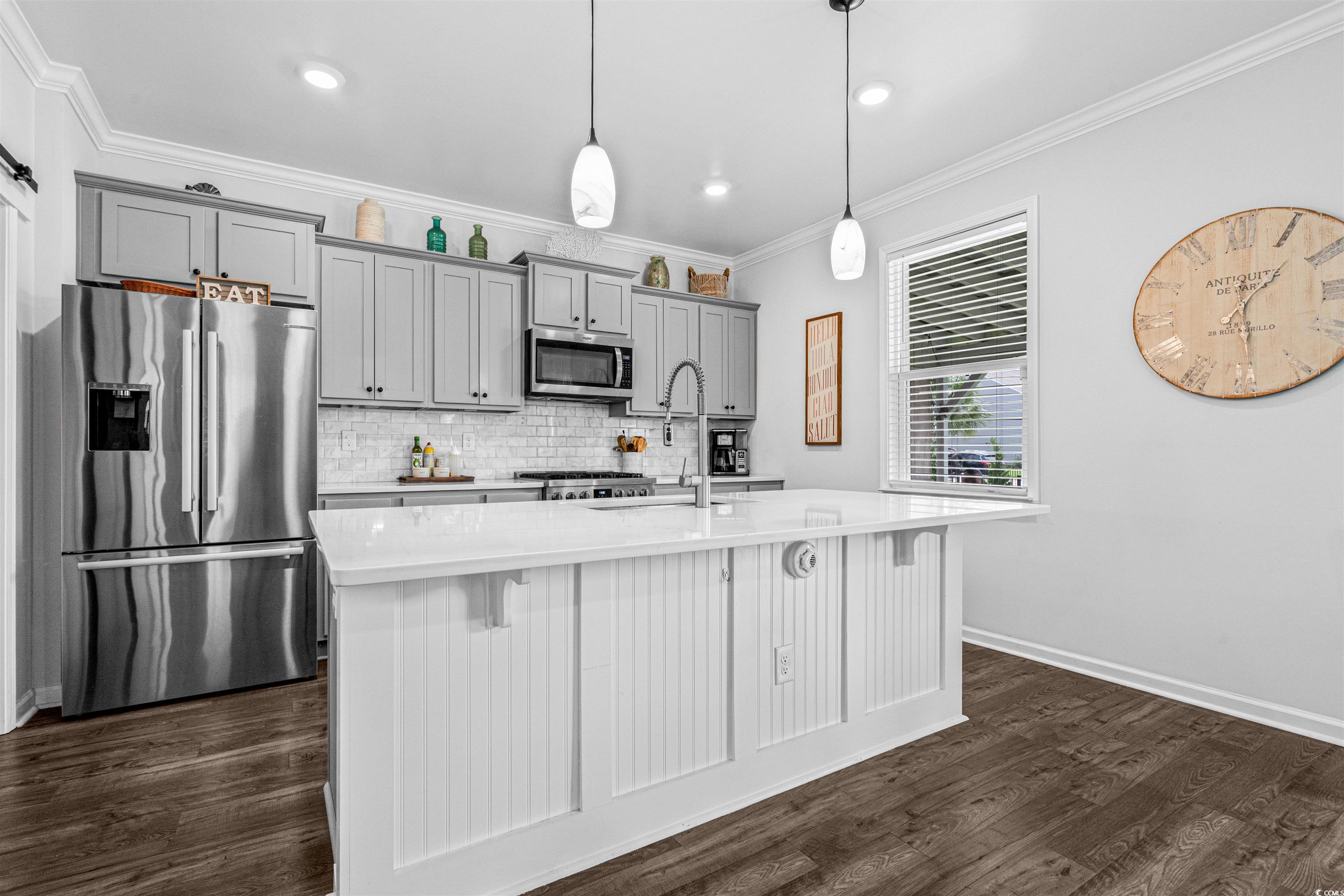 331 Emery Oak Drive Murrells Inlet, SC 29576 - Photo 9 of 32 Island with pendant lighting and quartz counter for eating.