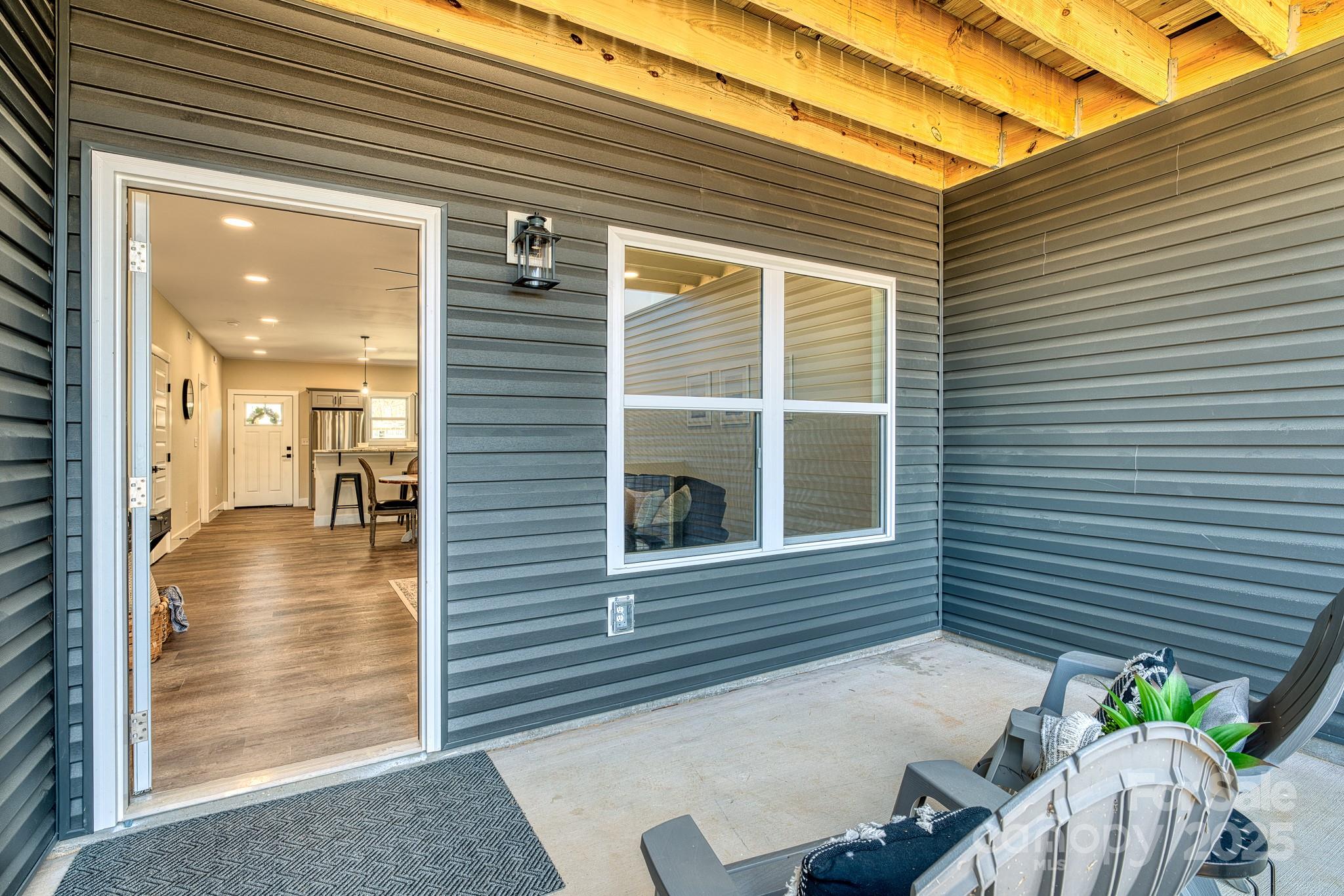143 Carver Street, Unit 7 Brevard, NC 28712 - Photo 13 of 28 a view of a porch with seating space
