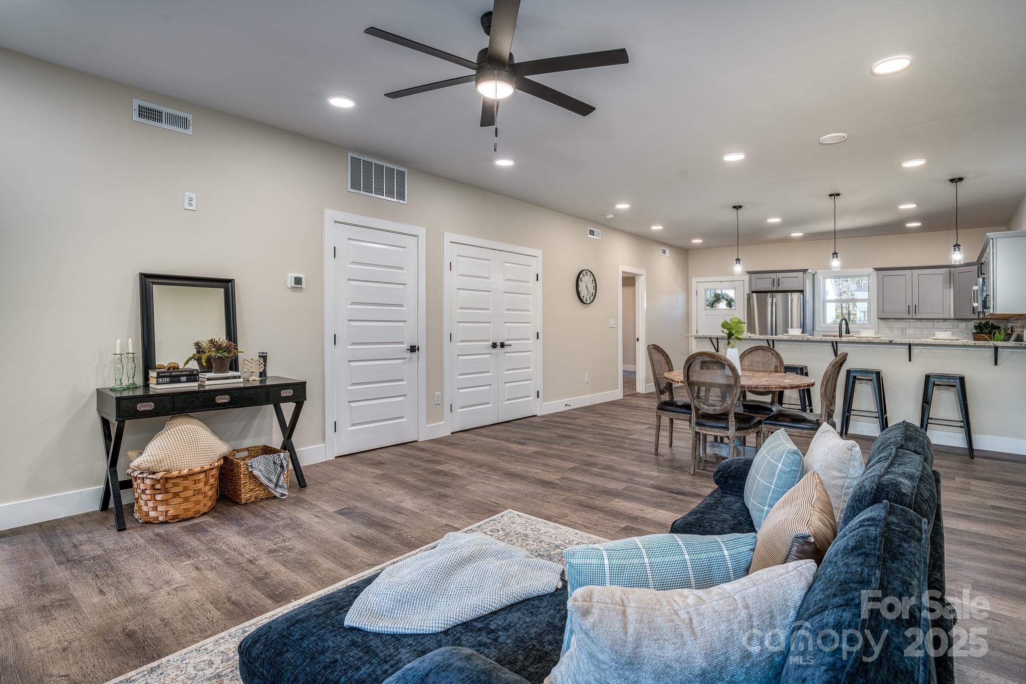 143 Carver Street, Unit 7 Brevard, NC 28712 - Photo 17 of 28 a living room with furniture and wooden floor