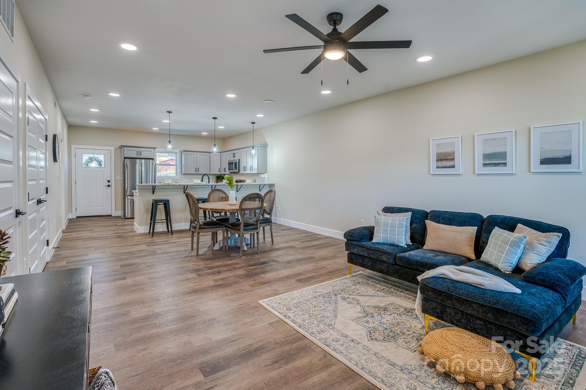 143 Carver Street, Unit 7 Brevard, NC 28712 - Photo 18 of 28 a living room with furniture and kitchen view