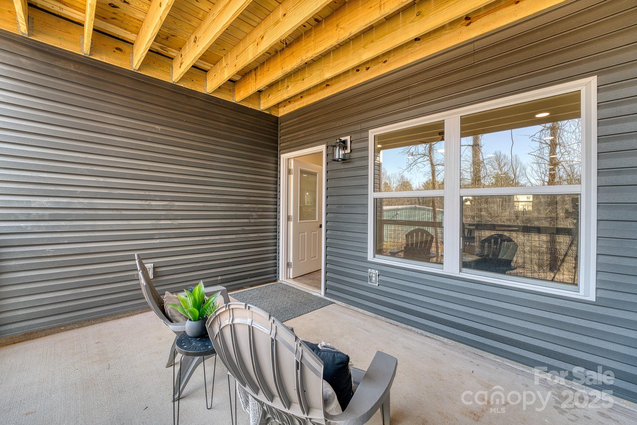 143 Carver Street, Unit 7 Brevard, NC 28712 - Photo 26 of 28 a view of a porch with seating space