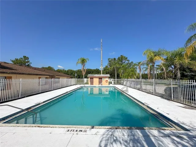 a view of a swimming pool with a patio