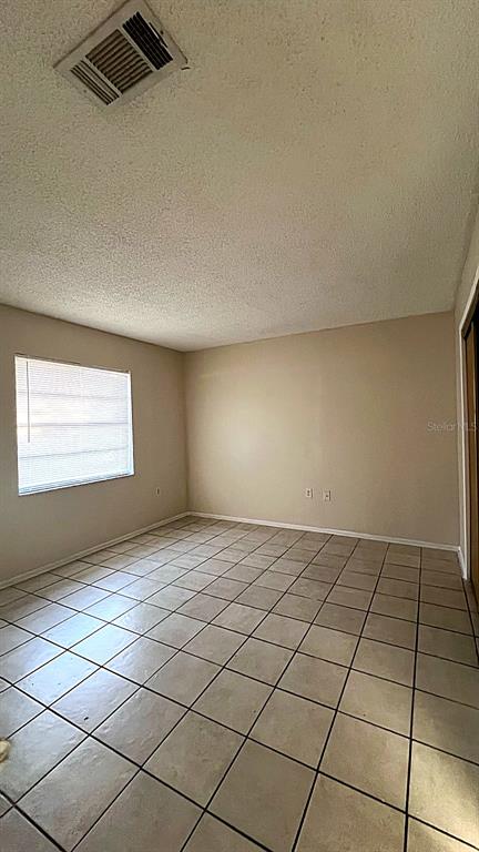 4166 Flying Fortress Avenue Kissimmee, FL 34741 - Photo 5 of 14 a view of an empty room and a window