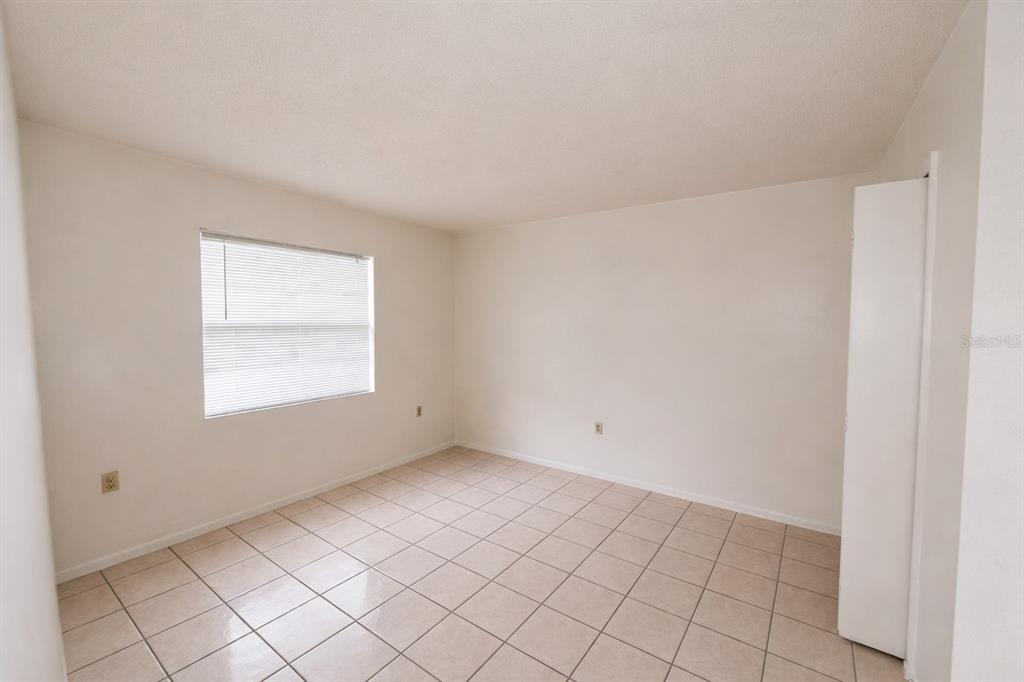 4166 Flying Fortress Avenue Kissimmee, FL 34741 - Photo 7 of 14 a view of an empty room and window