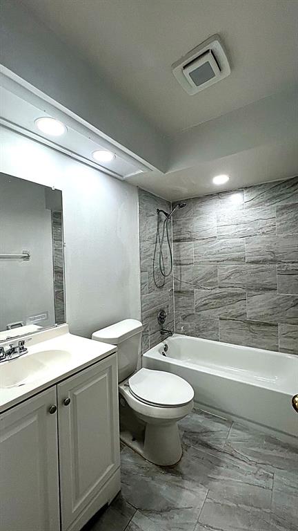 4166 Flying Fortress Avenue Kissimmee, FL 34741 - Photo 8 of 14 a bathroom with a sink a toilet and shower