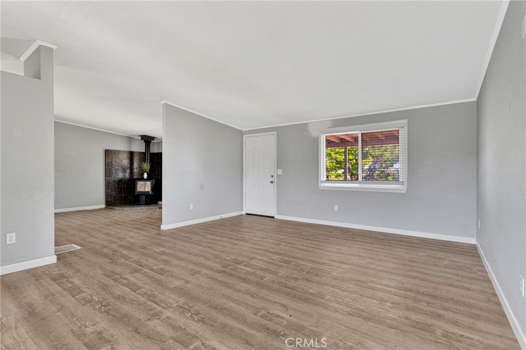 8074 Mira Mar Road Phelan, CA 92371 - Photo 7 of 49 wooden floor in an empty room with closet