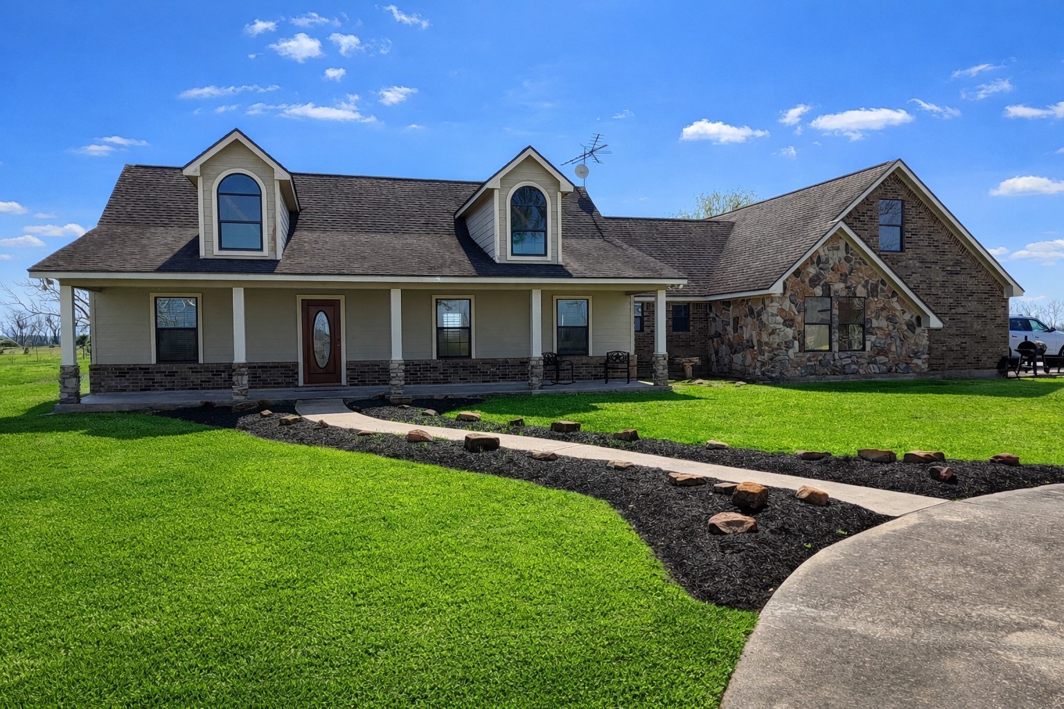 a front view of a house with a yard