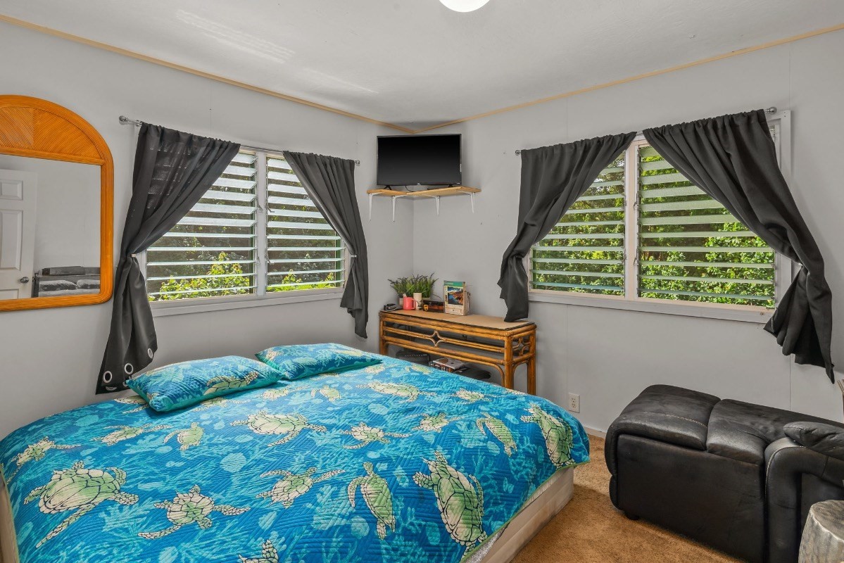 4430 Eke Road Koloa, HI 96756 - Photo 13 of 25 a bedroom with a bed and a window