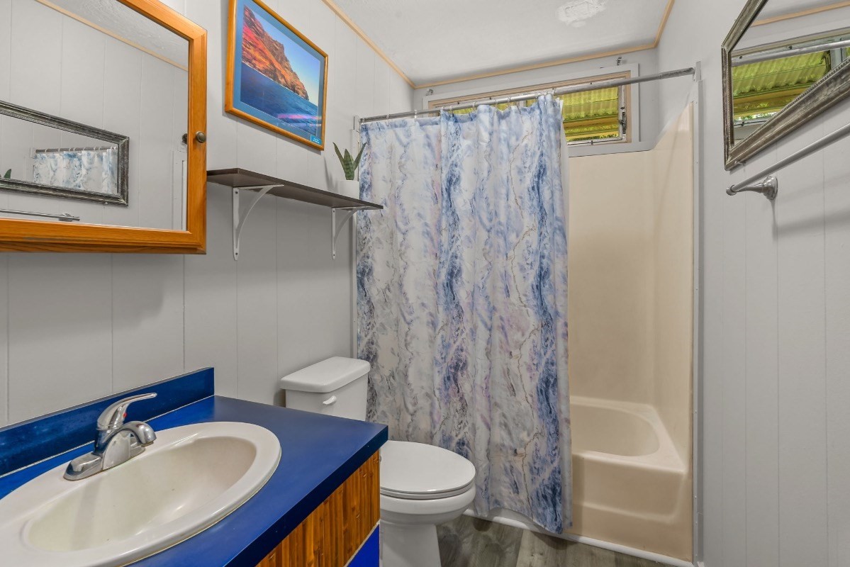4430 Eke Road Koloa, HI 96756 - Photo 15 of 25 a bathroom with a sink toilet and shower
