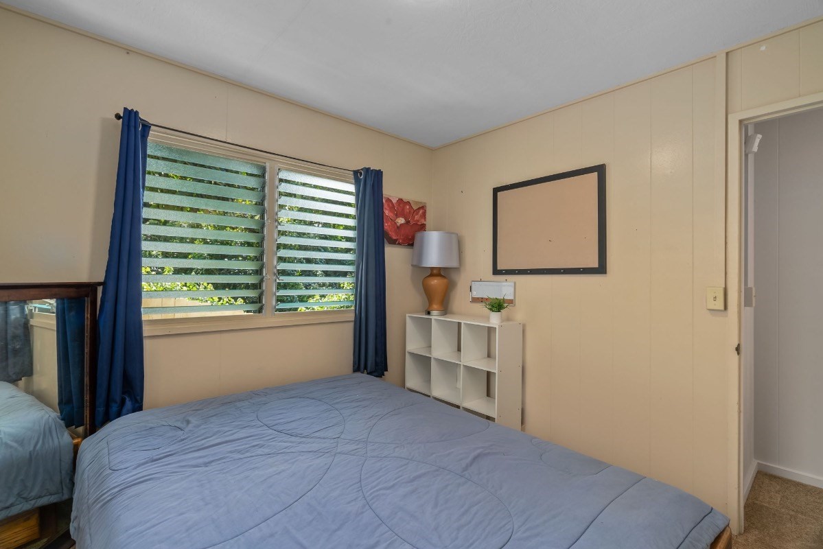 4430 Eke Road Koloa, HI 96756 - Photo 16 of 25 a bedroom with a bed and a window
