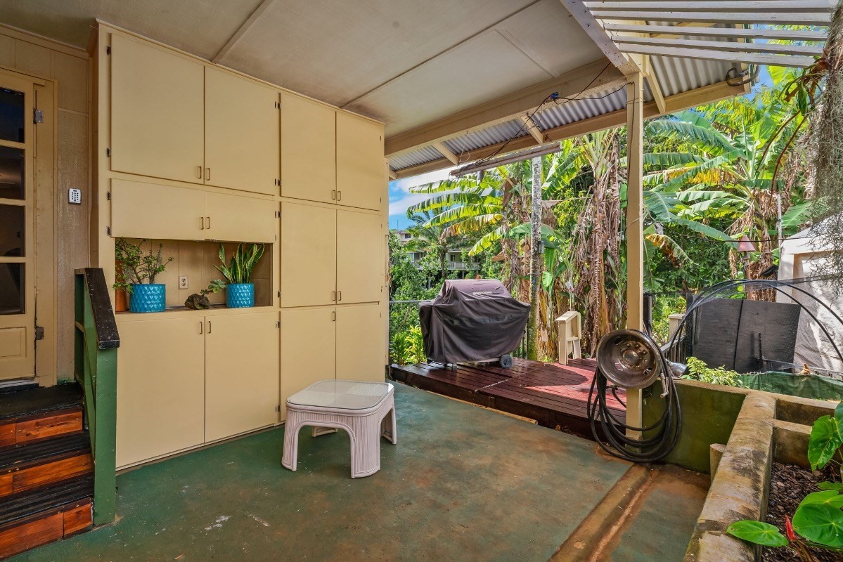 4430 Eke Road Koloa, HI 96756 - Photo 18 of 25 a view of a chairs and table in backyard