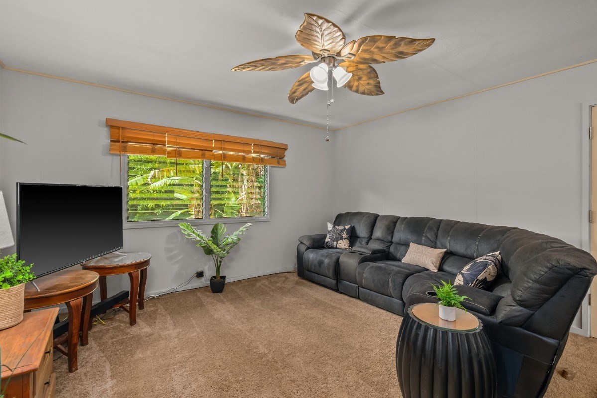 4430 Eke Road Koloa, HI 96756 - Photo 7 of 25 a living room with furniture and a large window