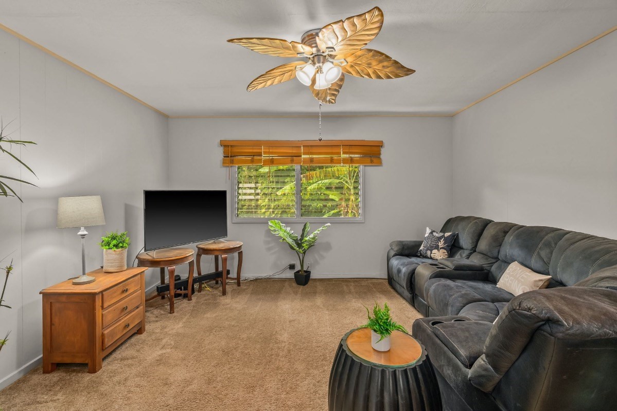 4430 Eke Road Koloa, HI 96756 - Photo 8 of 25 a living room with furniture a window and a flat screen tv