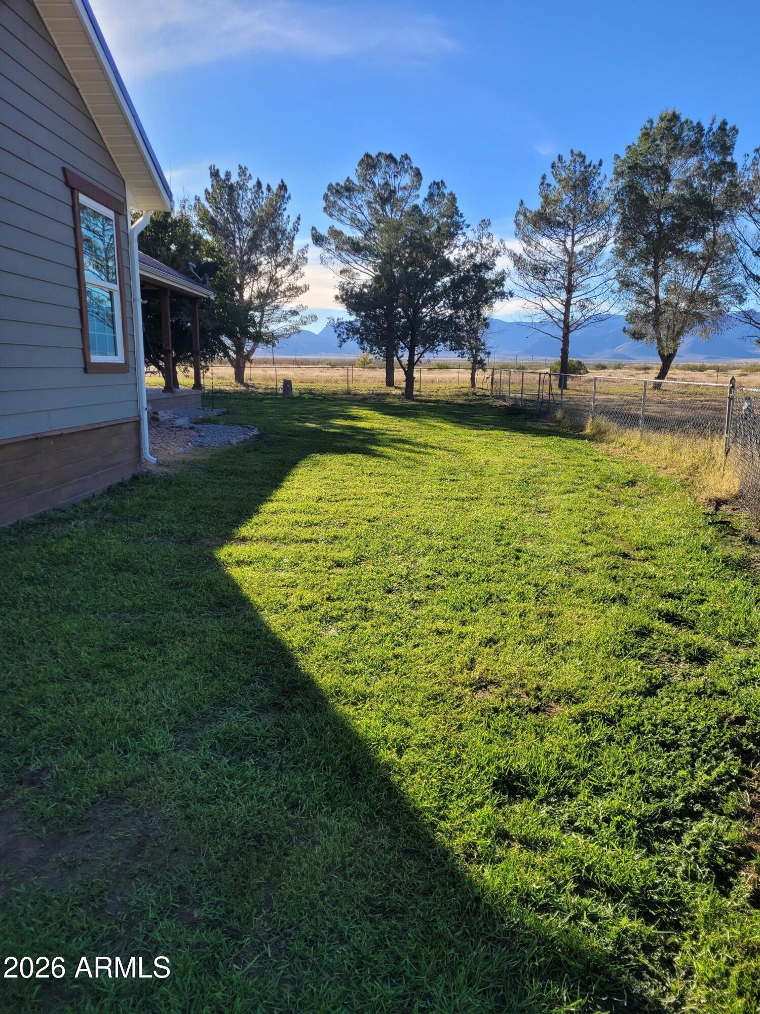 8255 North Fort Grant Road Willcox, AZ 85643 - Photo 14 of 40 a view of a swimming pool with a yard