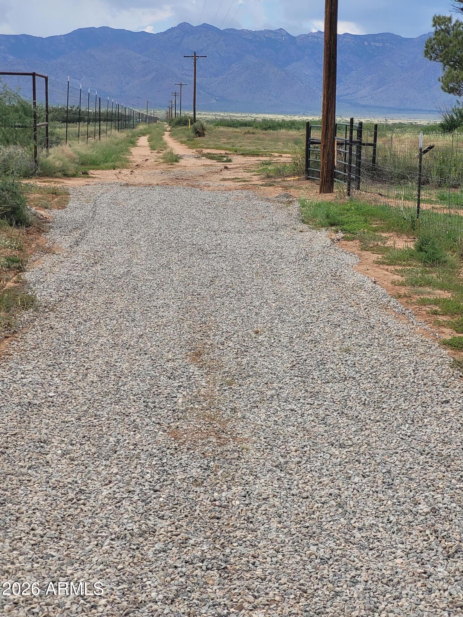 8255 North Fort Grant Road Willcox, AZ 85643 - Photo 18 of 40 a view of a yard with a chair