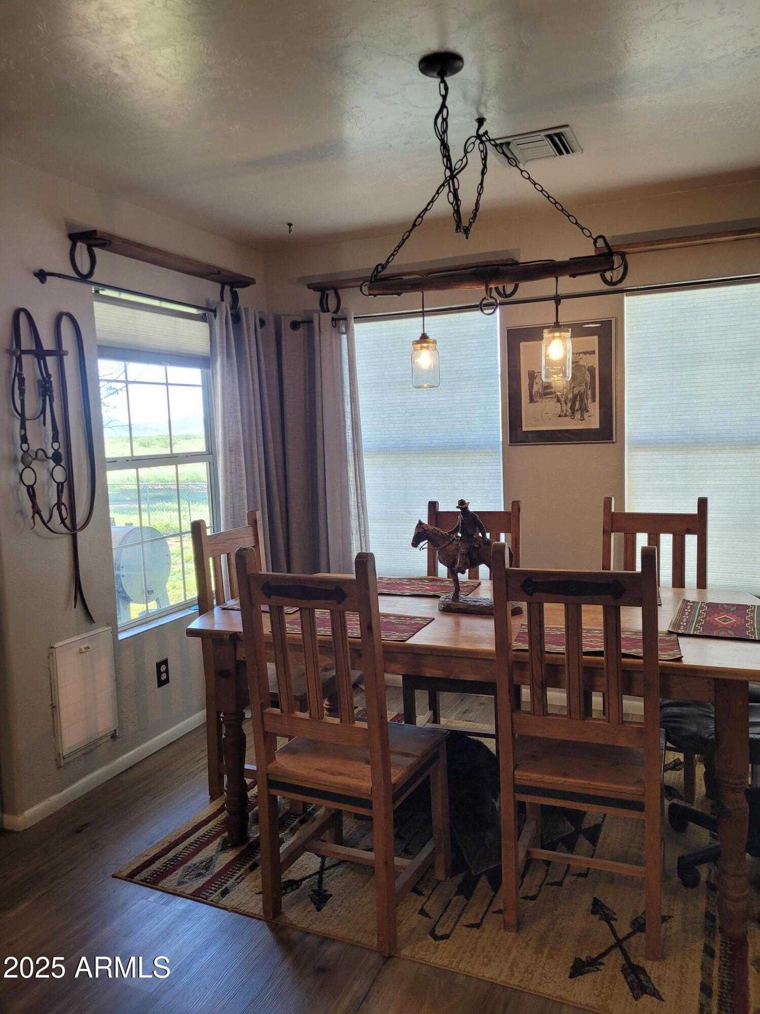 8255 North Fort Grant Road Willcox, AZ 85643 - Photo 22 of 40 a view of a dining room with furniture and window