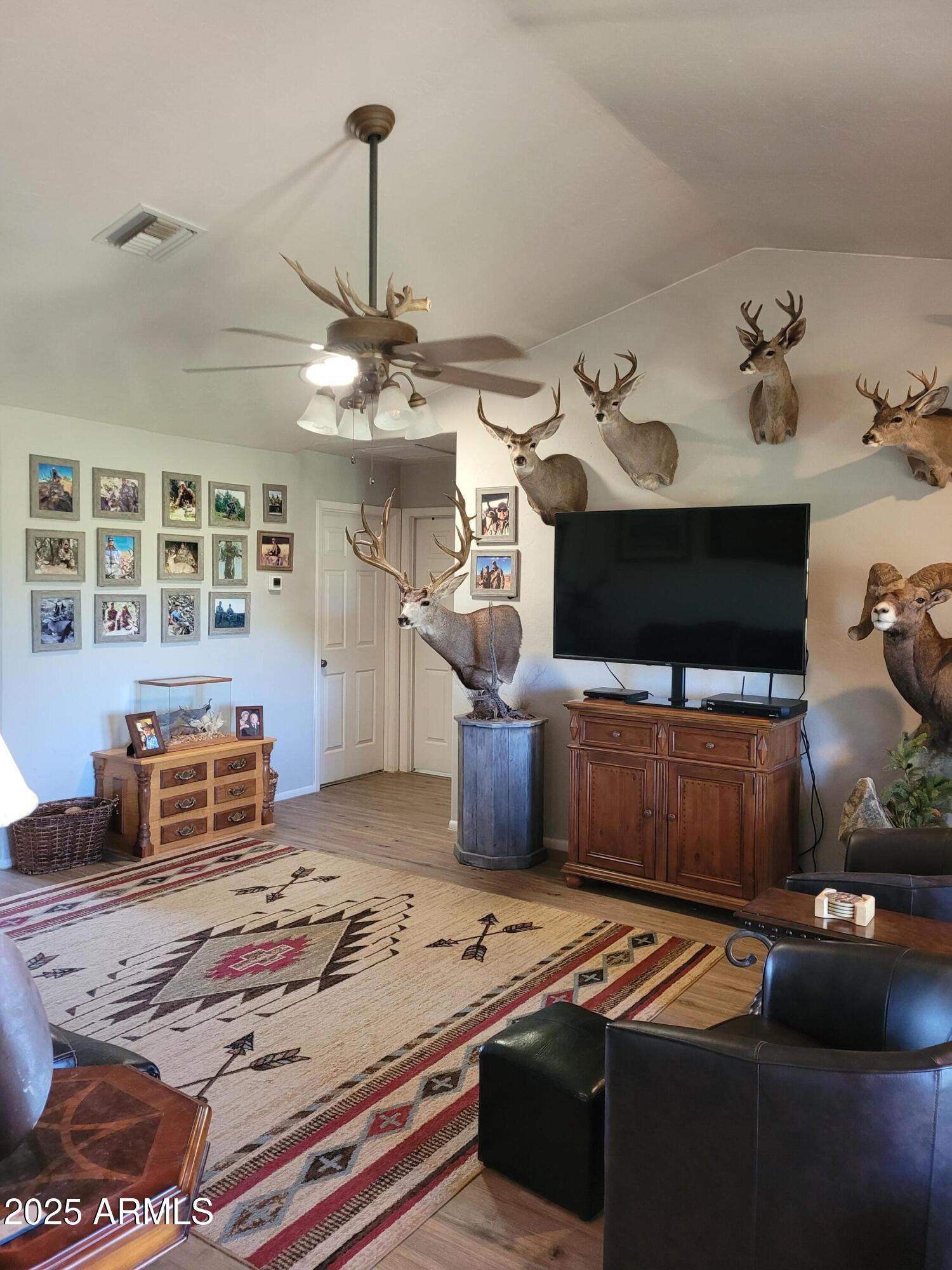 8255 North Fort Grant Road Willcox, AZ 85643 - Photo 25 of 40 a living room with furniture and flat screen tv