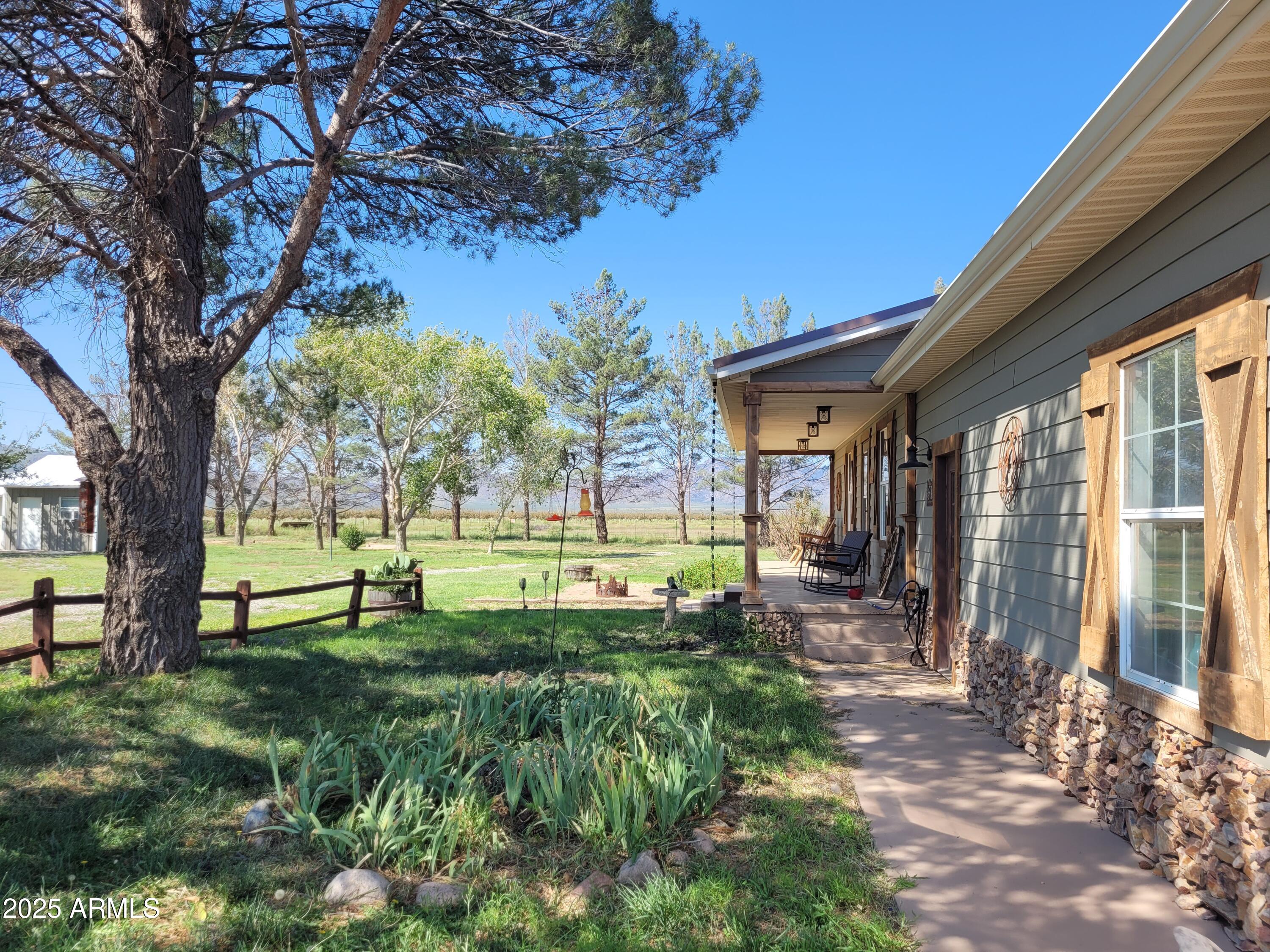 8255 North Fort Grant Road Willcox, AZ 85643 - Photo 3 of 40 a view of a house with backyard and a tree