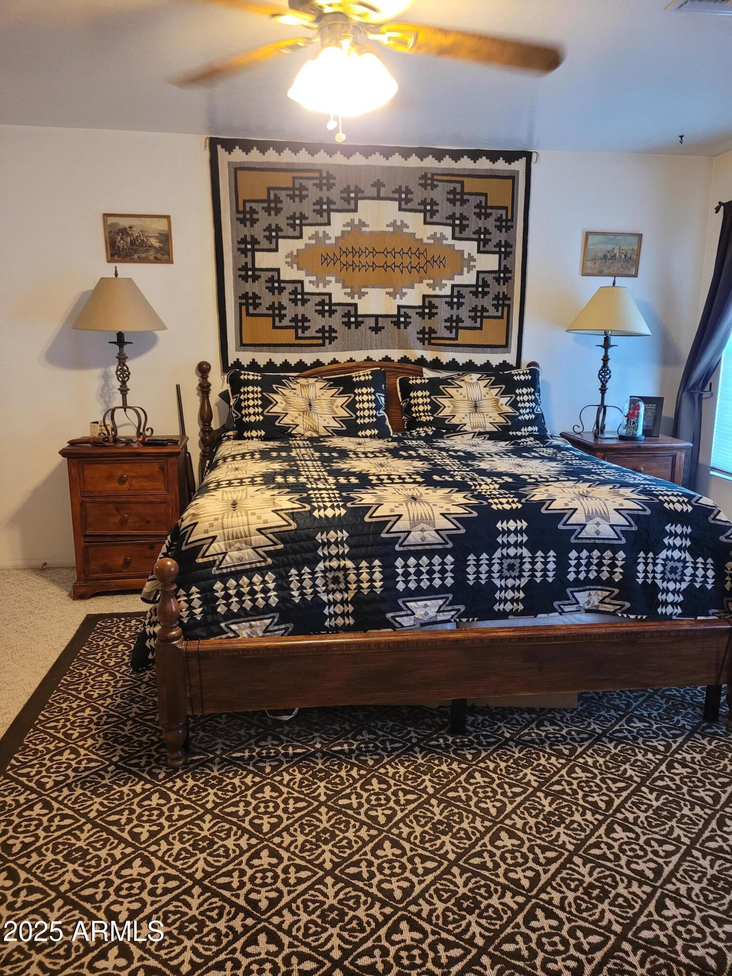 8255 North Fort Grant Road Willcox, AZ 85643 - Photo 33 of 40 a bedroom with a bed and a table