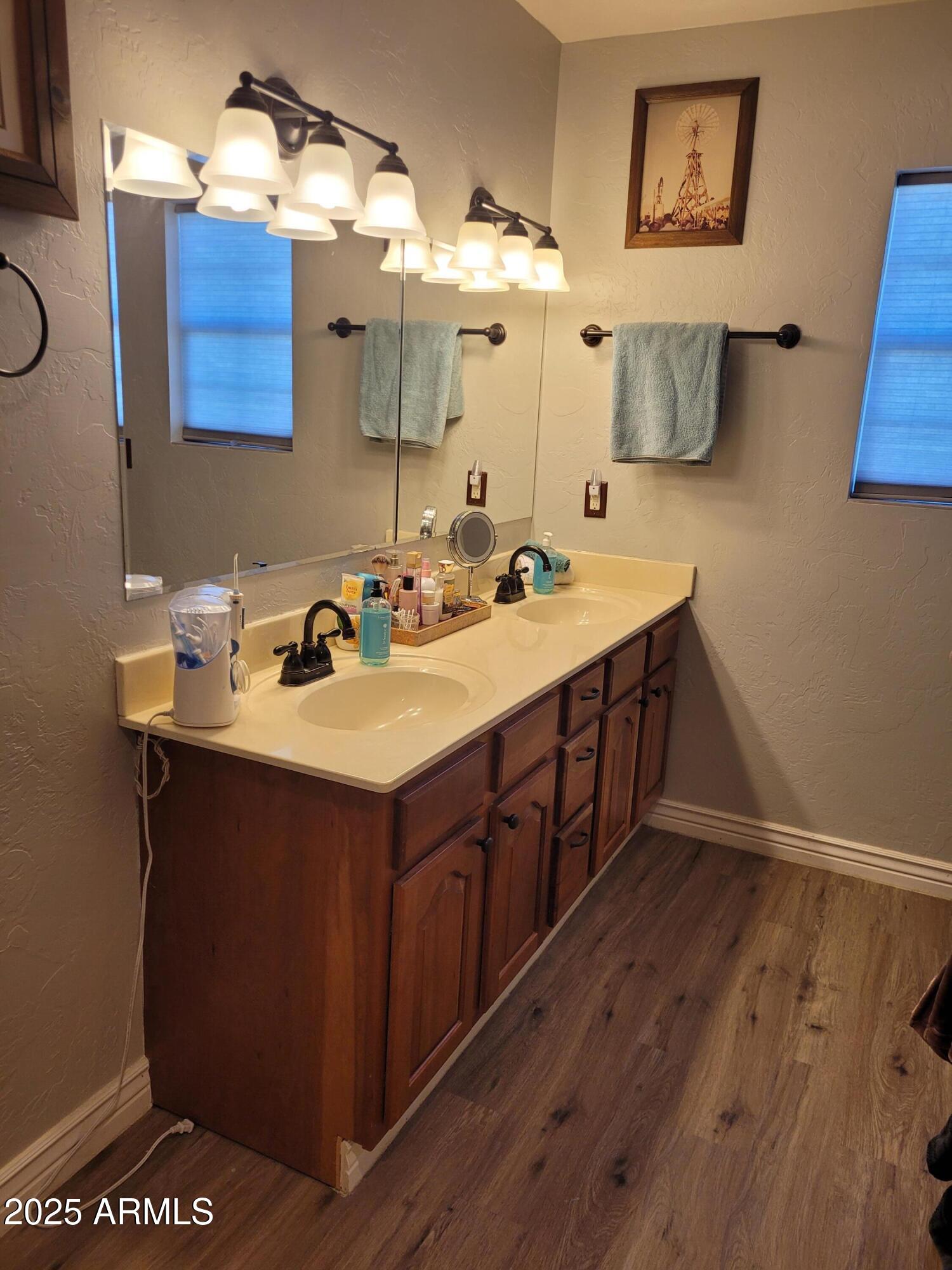 8255 North Fort Grant Road Willcox, AZ 85643 - Photo 36 of 40 a kitchen with a sink cabinets and wooden floor