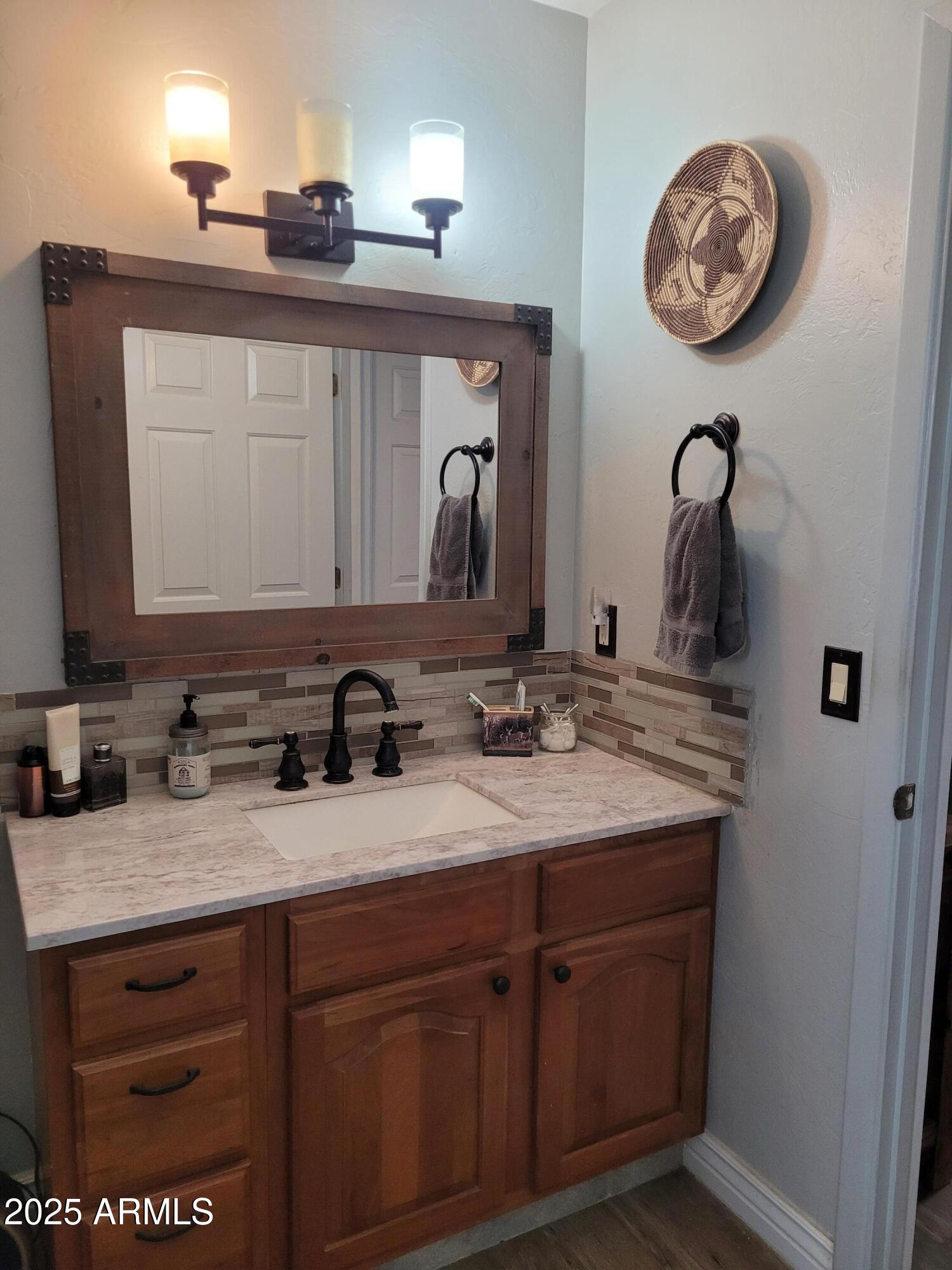 8255 North Fort Grant Road Willcox, AZ 85643 - Photo 40 of 40 a bathroom with a sink and a mirror