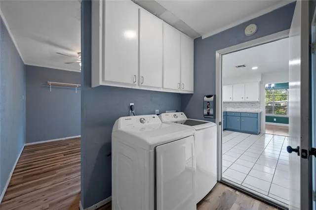 a view of storage and utility room with washer and dryer