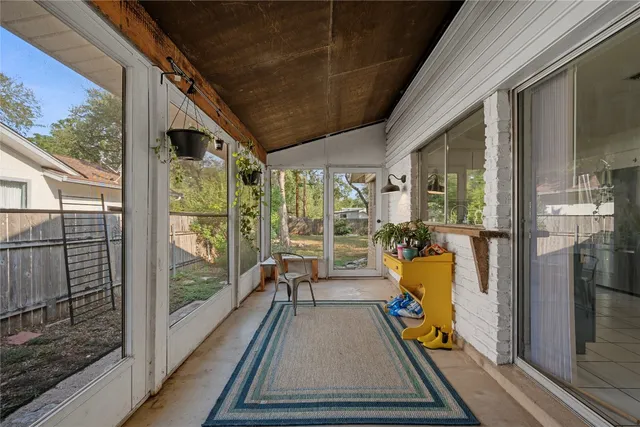 a view of a balcony with furniture
