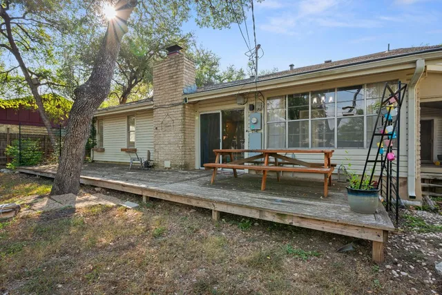a backyard of a house with outdoor seating