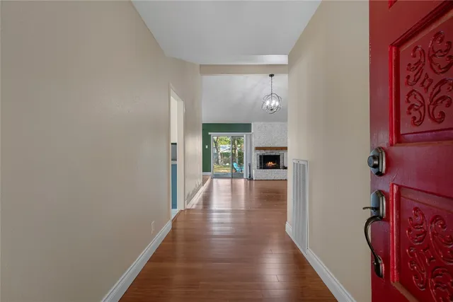 a view of an entryway of a house and wooden floor