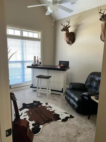 a living room with furniture and a window