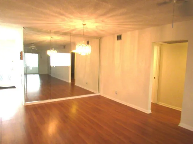 a view of a livingroom with wooden floor