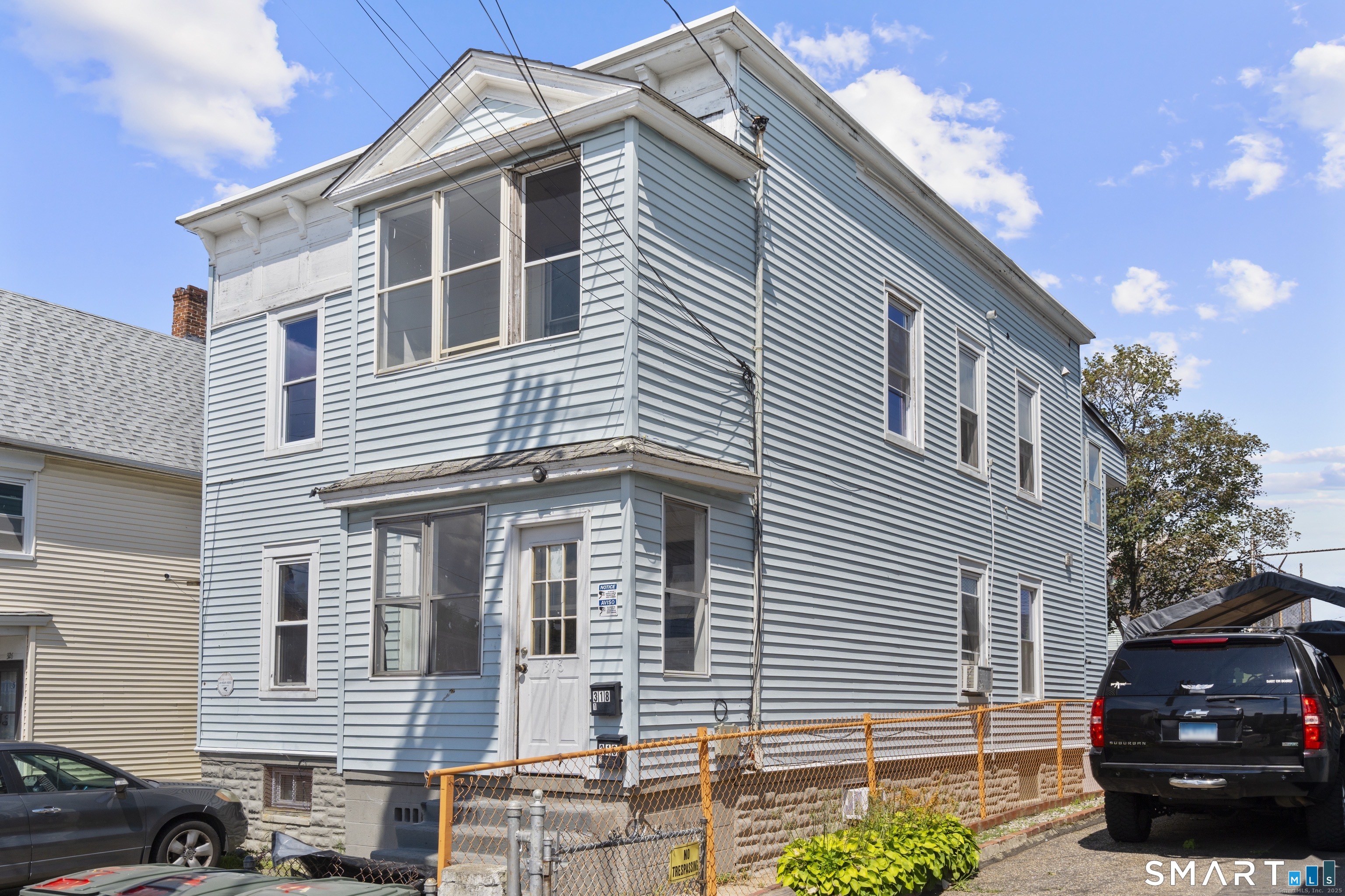 318 Center Street Bridgeport, CT 06604 - Photo 2 of 9 a front view of a house with a street