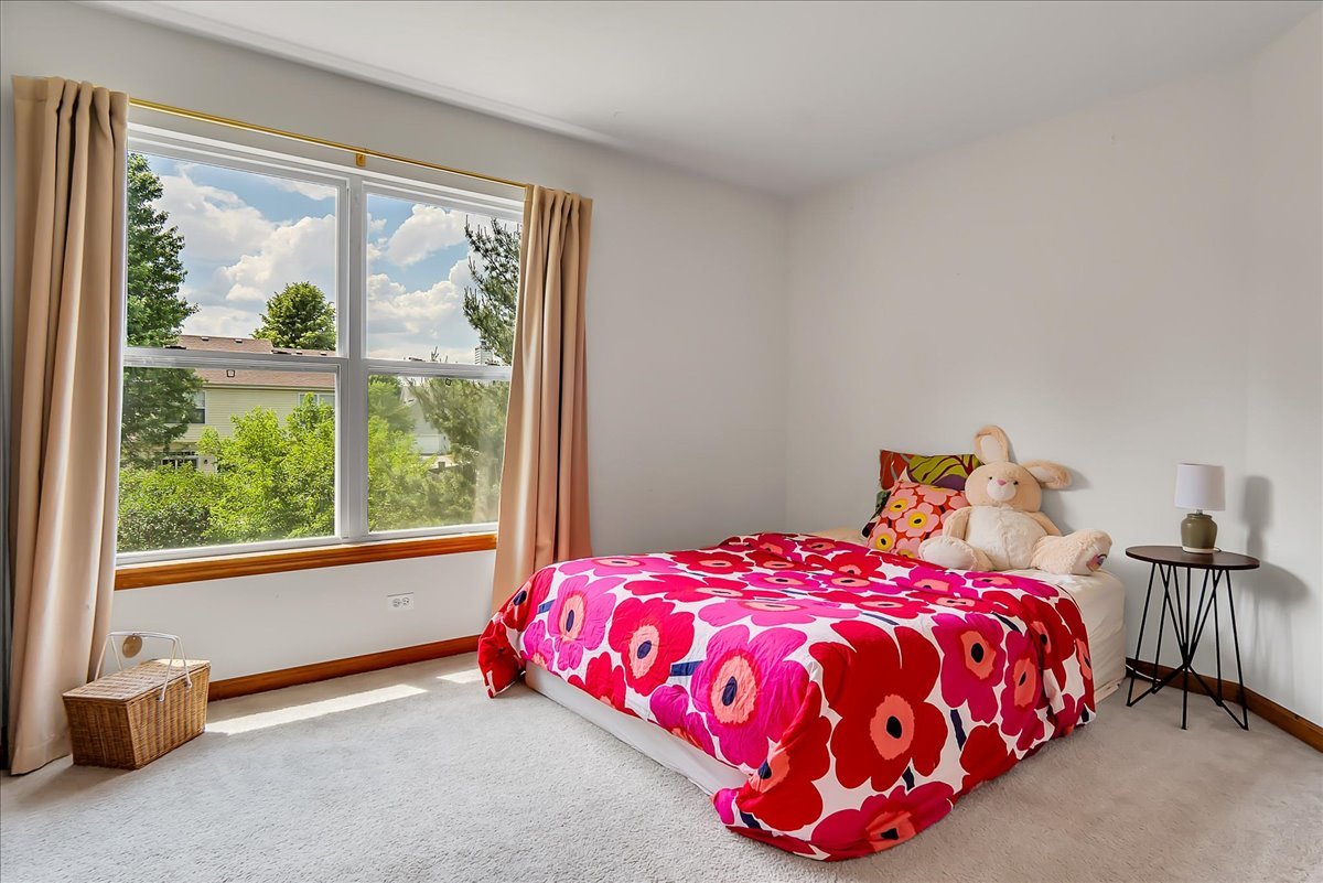 255 Hampton Road Sugar Grove, IL 60554 - Photo 14 of 28 a bedroom with a bed and a window