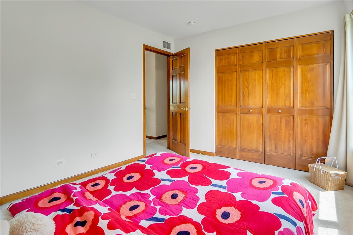 255 Hampton Road Sugar Grove, IL 60554 - Photo 15 of 28 a bedroom with a bed and a curtain