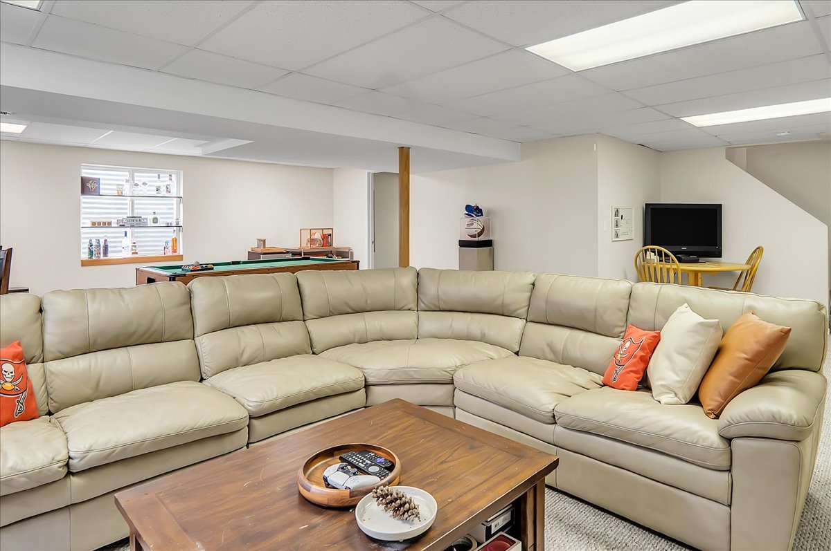 255 Hampton Road Sugar Grove, IL 60554 - Photo 20 of 28 a living room with furniture a flat screen tv and a window